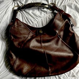 YSL Mombasa. Mid-sized hobo-style. Horn and silver handle. Dark walnut brown.